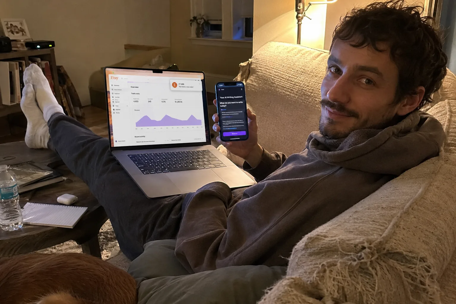 Creator at a laptop reviewing an Etsy seller dashboard with digital ebook listings, morning coffee on the counter