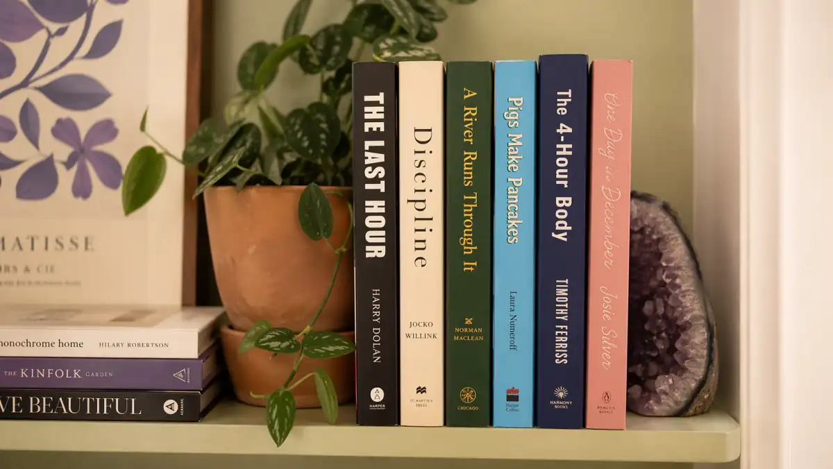 A curated bookshelf showing finished paperbacks across multiple genres in 2026: short-title thrillers, identity-forward self-help titles, single-word business books, and character-and-object children's titles, illustrating how title patterns perform differently across genres and what a successful self-published author's catalog looks like.