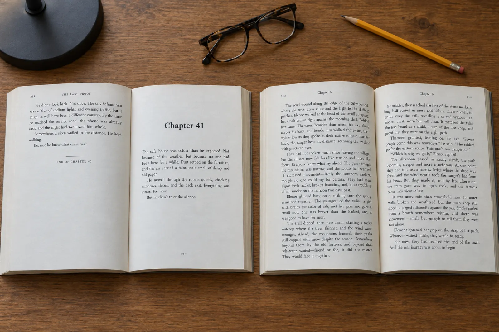 Two open paperbacks on a wooden table: a thriller open where one chapter ends a third of the way down the left page and Chapter 41 begins on the right, and an epic fantasy open at a spread of dense text with a running header reading Chapter 6