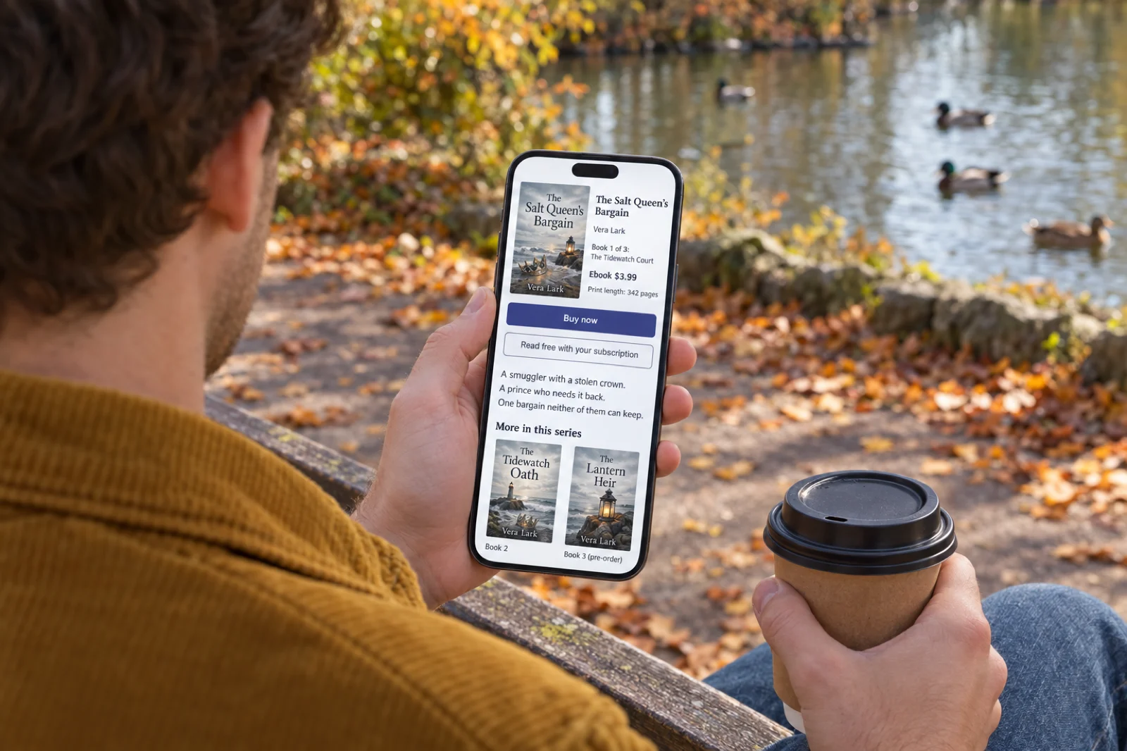 Over the shoulder of a young man in a mustard corduroy jacket on a park bench by a pond in autumn, holding a takeaway coffee and a phone showing an ebook product page with no store name: a cover of a silver crown half sunk in sand by a lantern, titled The Salt Queen's Bargain by Vera Lark, Book 1 of 3: The Tidewatch Court, Ebook $3.99, Print length: 342 pages, a Buy now button and a Read free with your subscription button, the blurb A smuggler with a stolen crown. A prince who needs it back. One bargain neither of them can keep., and a More in this series row showing The Tidewatch Oath, Book 2, and The Lantern Heir, Book 3 (pre-order)